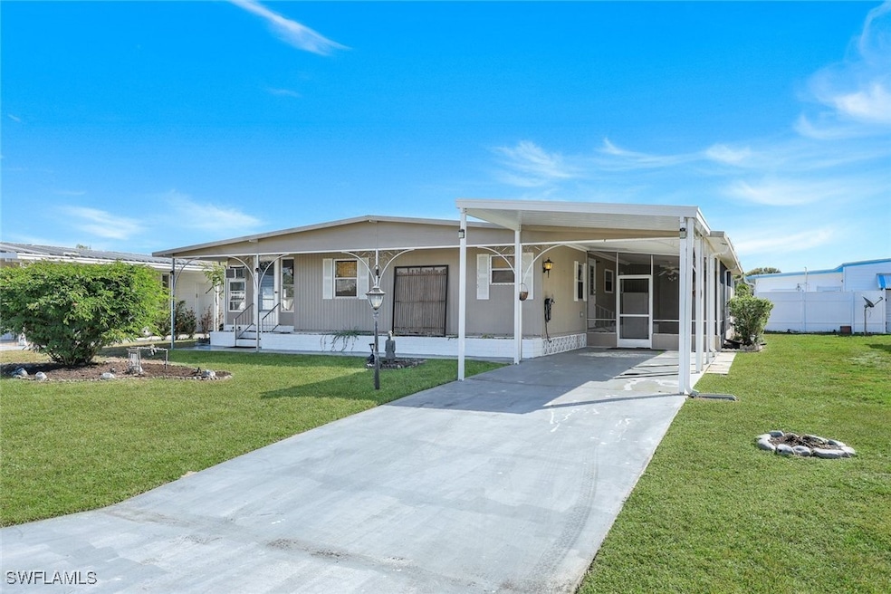 Front of home with carport and front yard