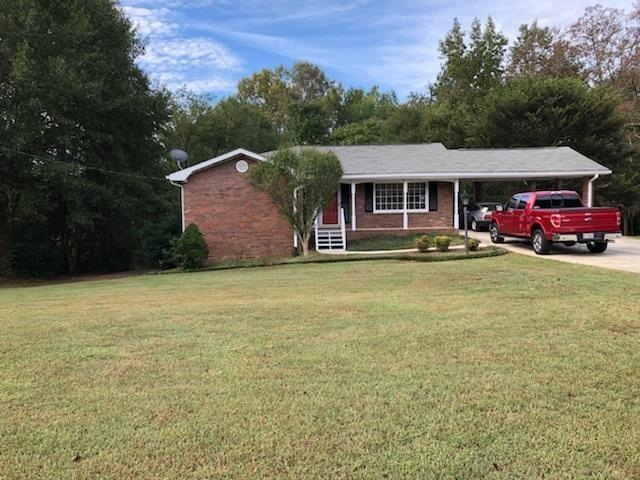 Front of Home 4 sided Brick Ranch on a Beautiful F