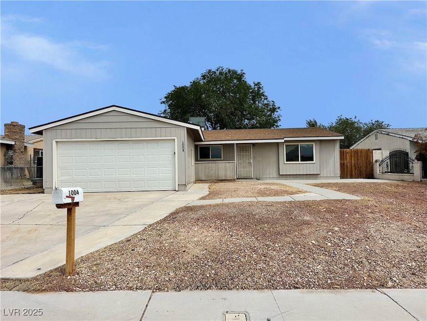Ranch-style home featuring driveway, an attached g