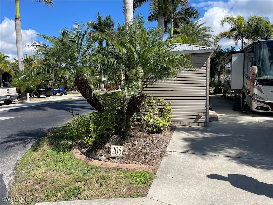View of side of home with concrete driveway