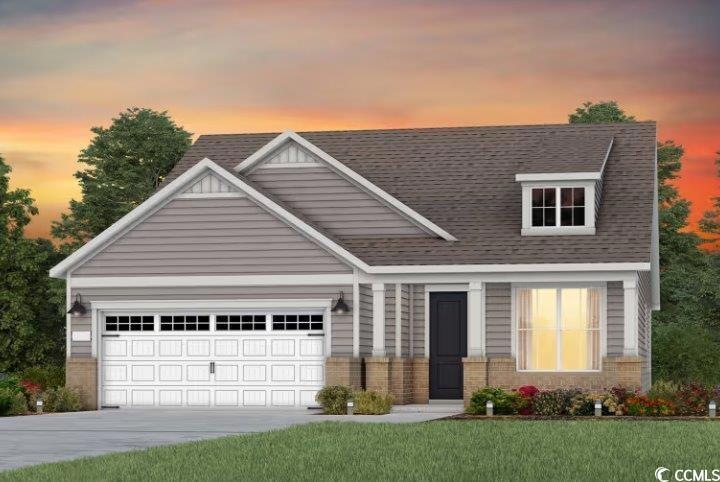 View of front of house featuring concrete driveway, roof with shingles, an attached garage, a front yard, and brick siding