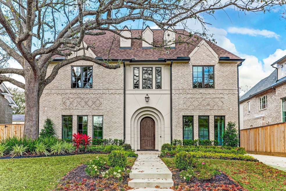 This enchanting English Traditional by Layne Kelly Homes is replete with designer finishes. The home resembles a charming storybook like facade showcasing a stately brick and stucco exterior with intricate detail, accented by lush manicured grounds. Inside, find a meticulously laid out three story floor plan.