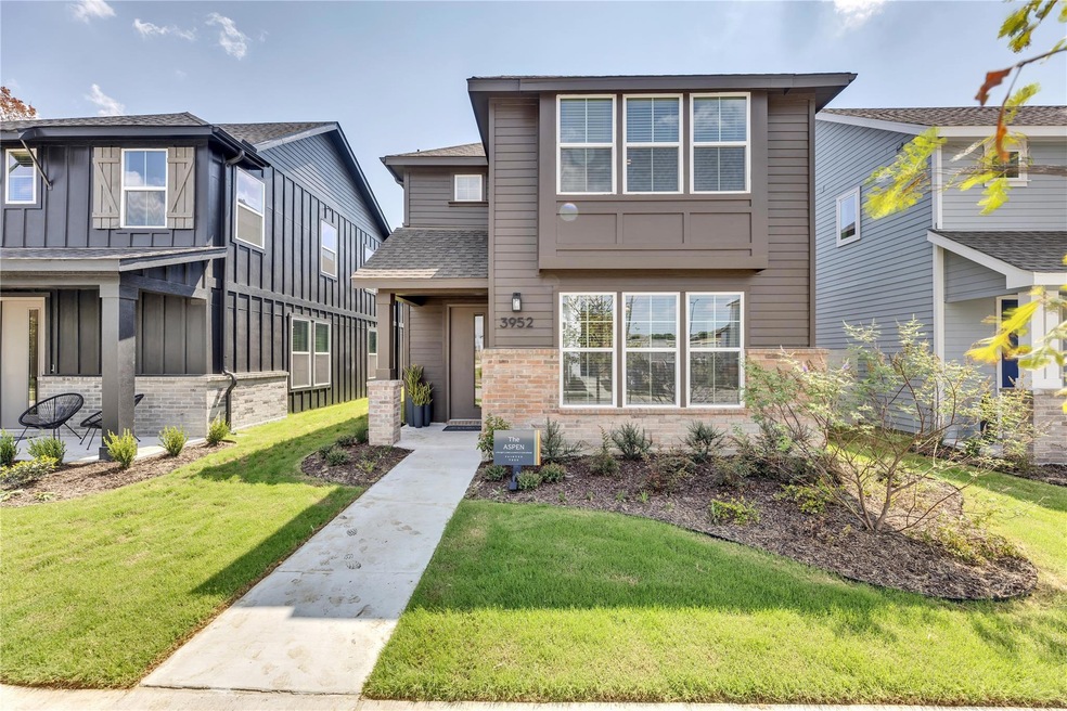 View of front facade featuring a front lawn, roof 