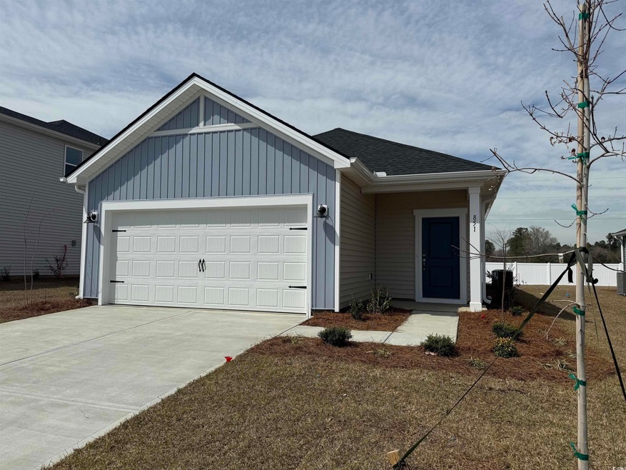 Ranch-style house with board and batten siding, a 