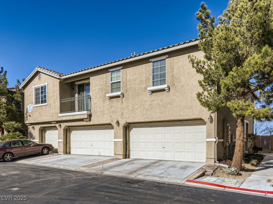 Townhome / multi-family property with driveway, a