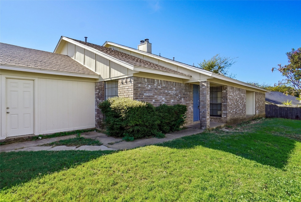View of property exterior with brick siding, a chimney, and roof with shingles