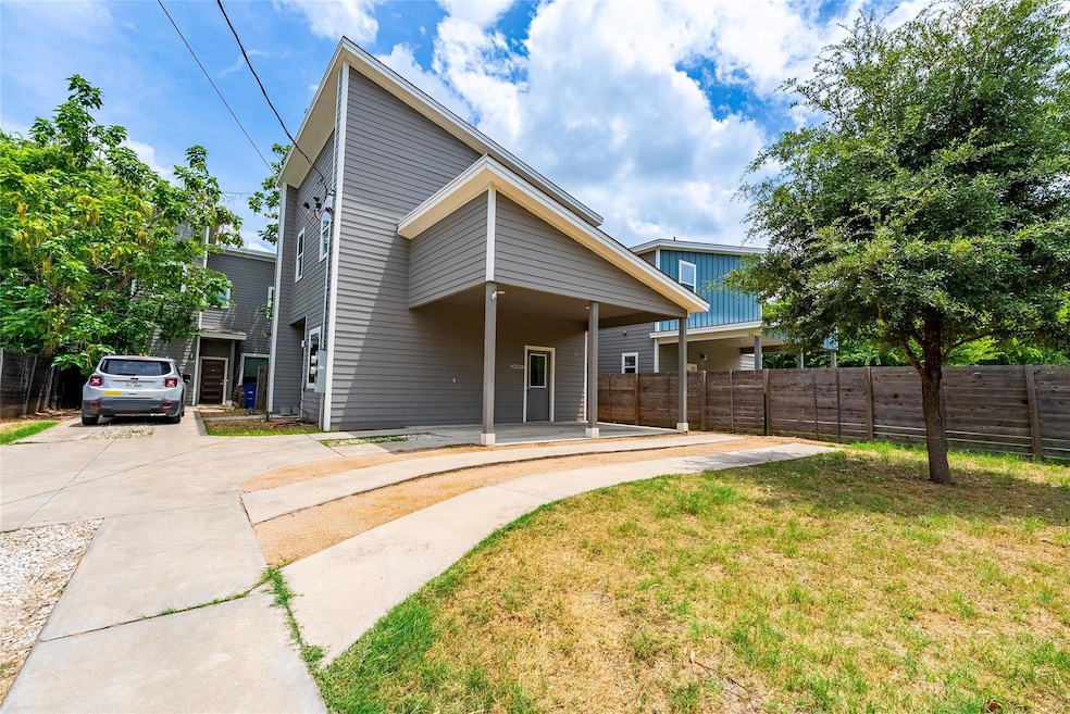 Rear view of property with driveway