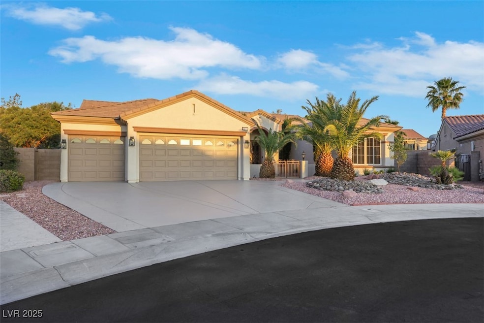 View of front of house featuring a garage, stucco