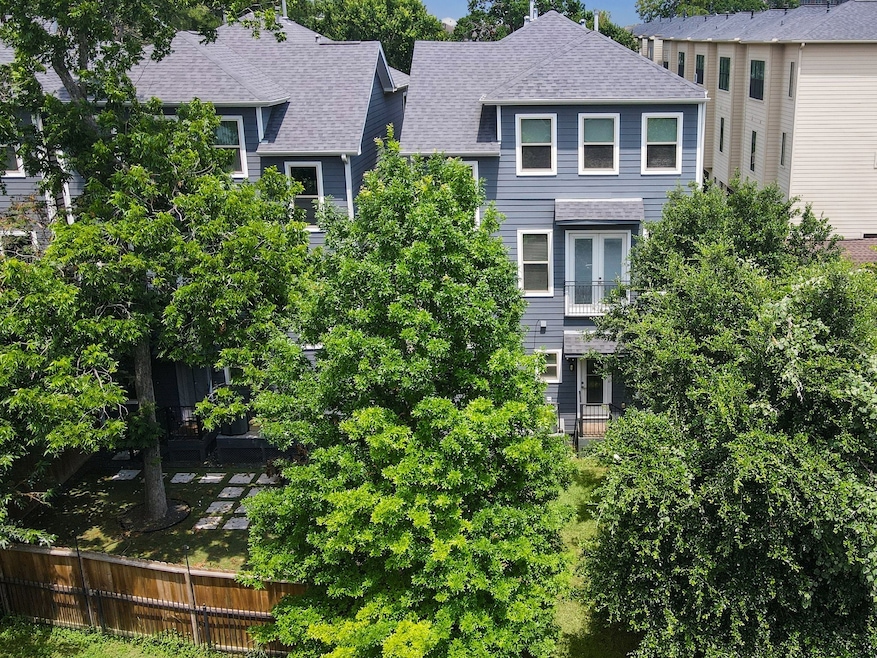 Welcome to 1230 West 25th, Unit E.   This townhome was completed in 2018 and is a RARE find. The oversized lot means a fabulous, big backyard which rivals the yards of million dollar homes in the area.  The back yard also enjoys privacy thanks to lovely, mature trees.