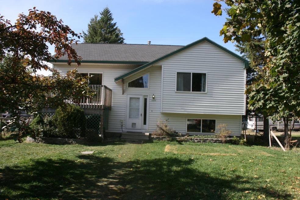Front of home with mature apple tree