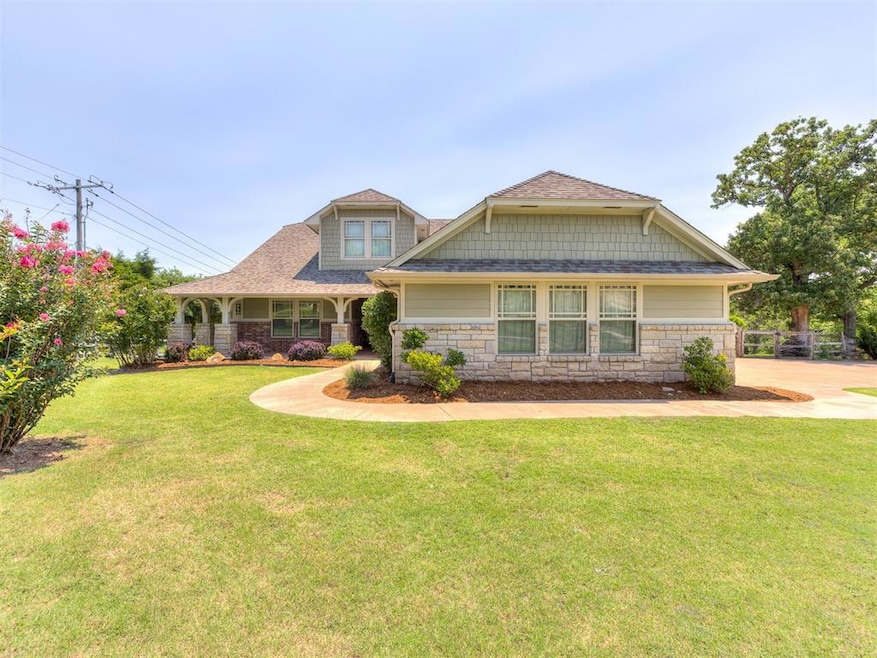 Craftsman-style home featuring a front lawn