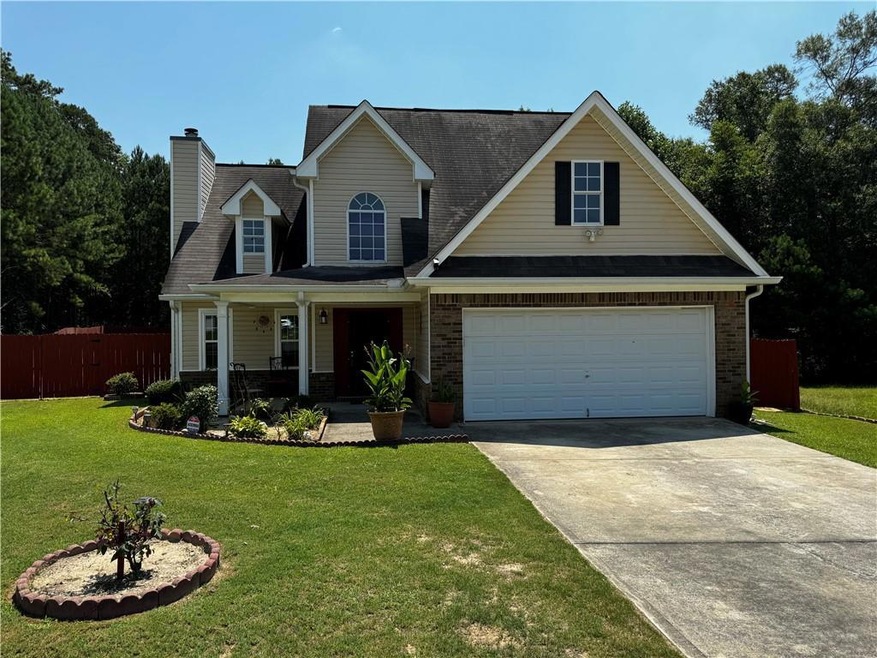 View of front of home featuring a garage, a front 