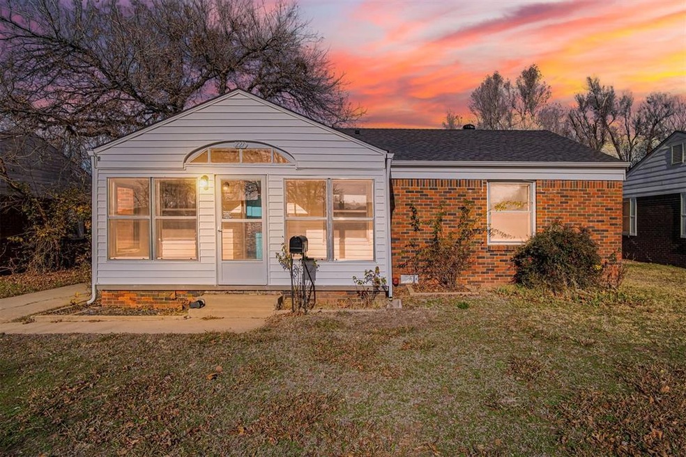 View of front of property with a lawn