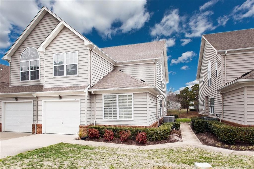 First floor living - lower level corner unit - 1 car  garage - side front door