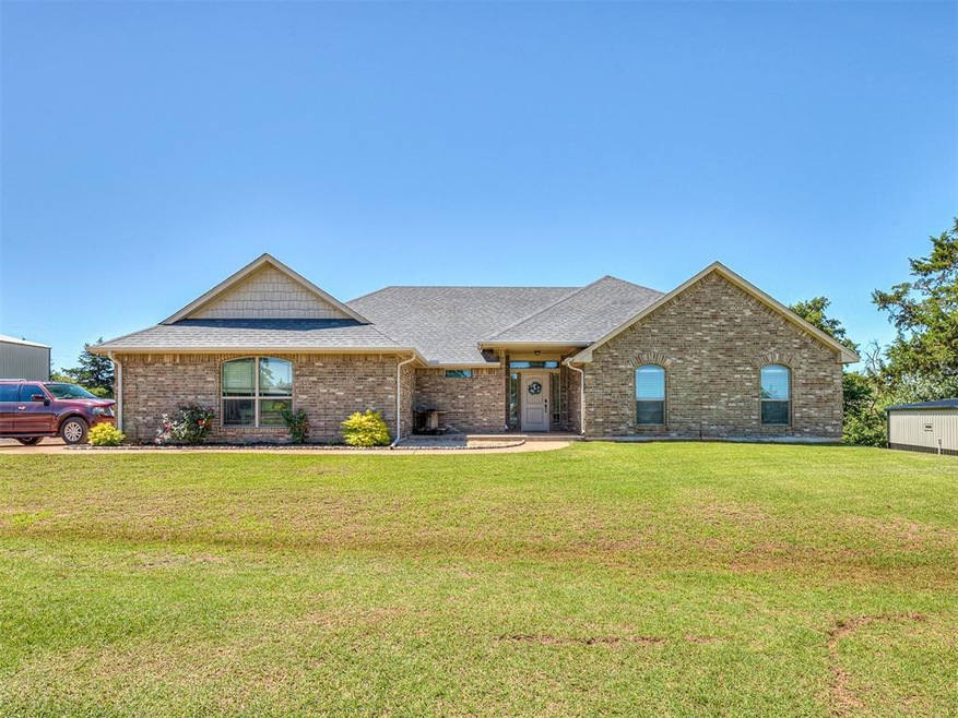 Ranch-style home with a front lawn