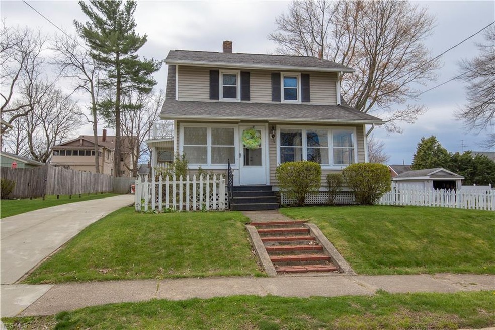 Front photo with most of the yard to the right in the photo.