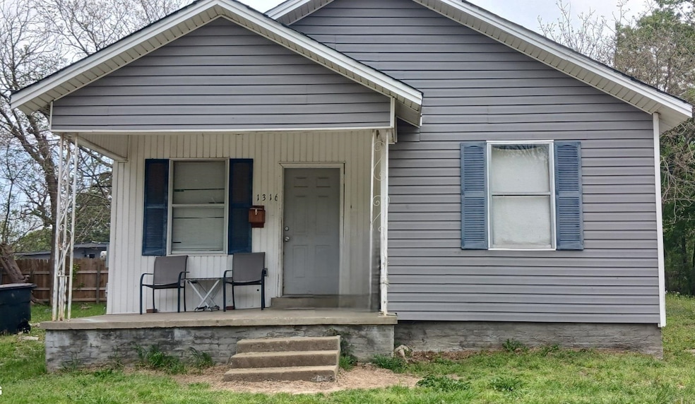 Bungalow-style house featuring a porch and fence
