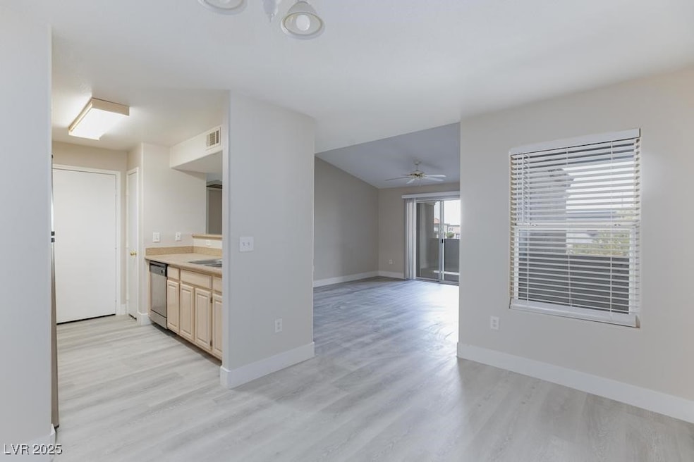 Kitchen featuring stainless steel dishwasher, ligh