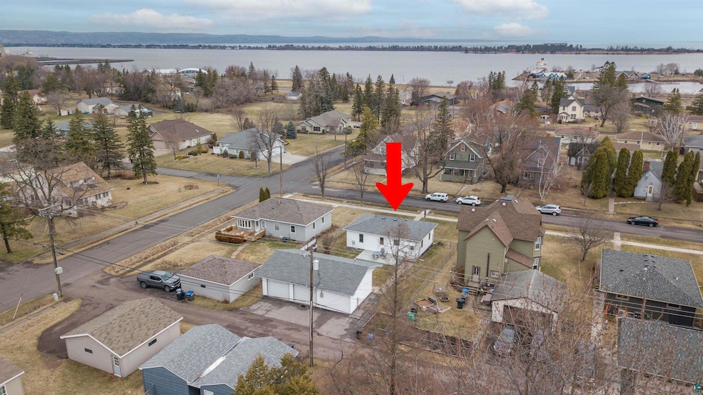 Birds eye view of property featuring a residential view and a water view