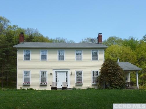Spacious center hall colonial in private location.