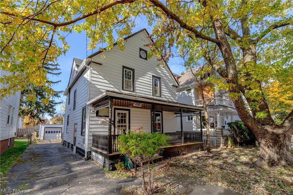 View of front of house with a garage and a porch