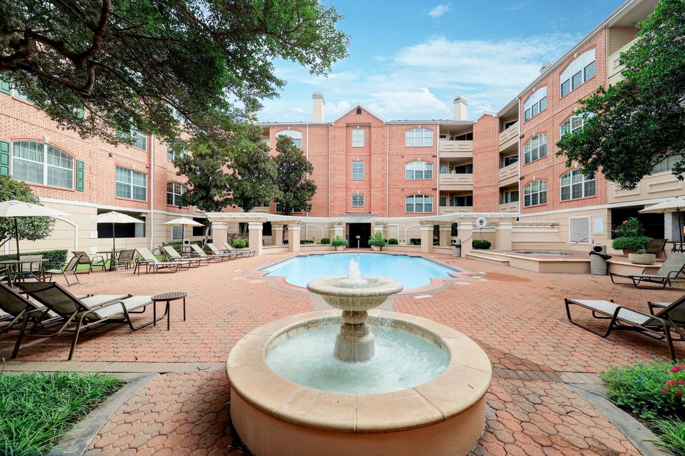Fountain and pool with spacious lounging areas.