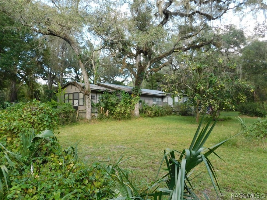 4.6 Acres with a 2 bedroom, 2 bath home, workshop,