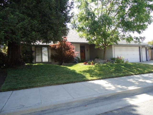 Traditional sale! The shady front yard of this lov