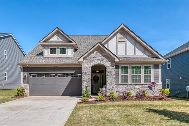 Stack stone accents and beautifully landscaped