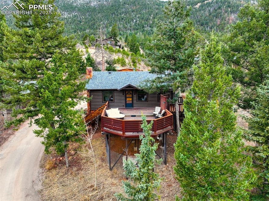 Birds eye view of property featuring a view of tre