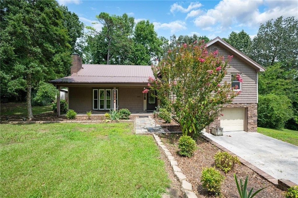 View of front of property featuring covered porch,