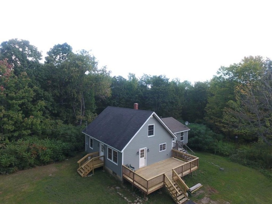 Aerial view of the home with a...