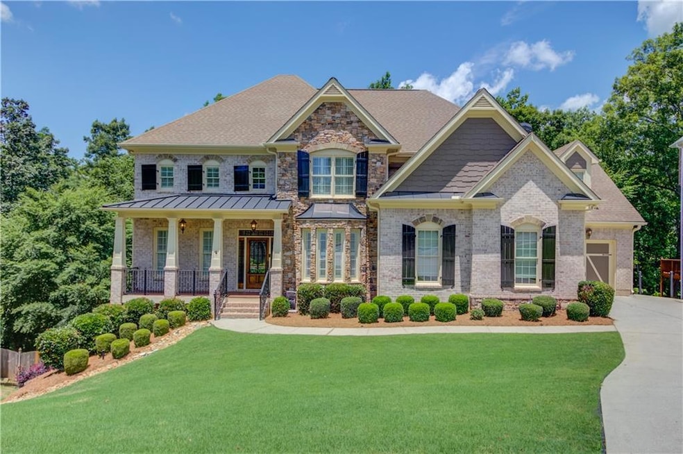 3 sides brick with stone accents and inviting front porch