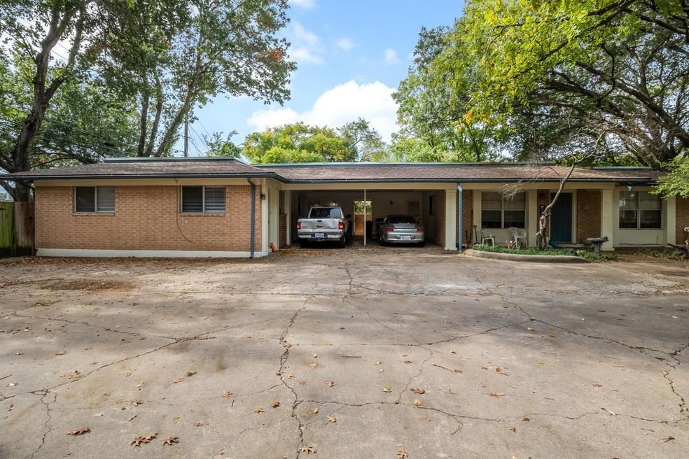 View of front of property featuring a carport, co