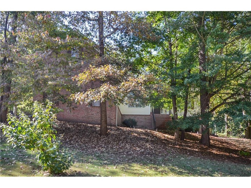 So much privacy with beautiful trees in front yard