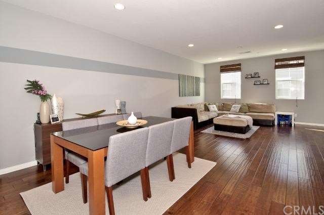 Great room features hardwood floors & lot of space