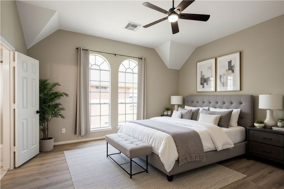 11735 Alief Clodine is ready for move in. Welcome inside your primary bedroom with a ceiling fan for maximum comfort. (Virtually Staged)