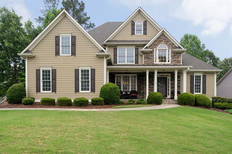 This beautiful five bedroom home sits on a corner lot in the highly sought after community, The Georgian ~ Villa Rica.