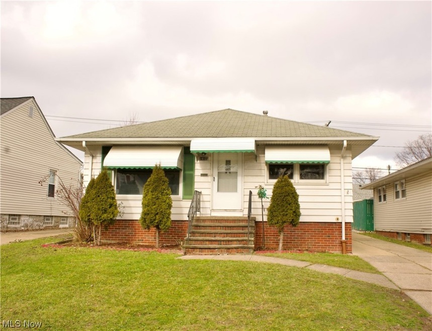 Bungalow-style home featuring a front lawn