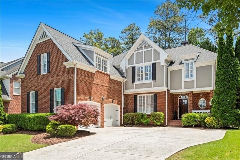 Tudor home with a garage