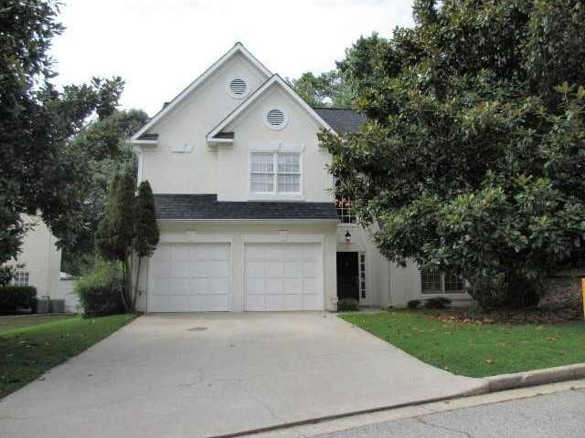 Exterior Front. Level front yard and drive way