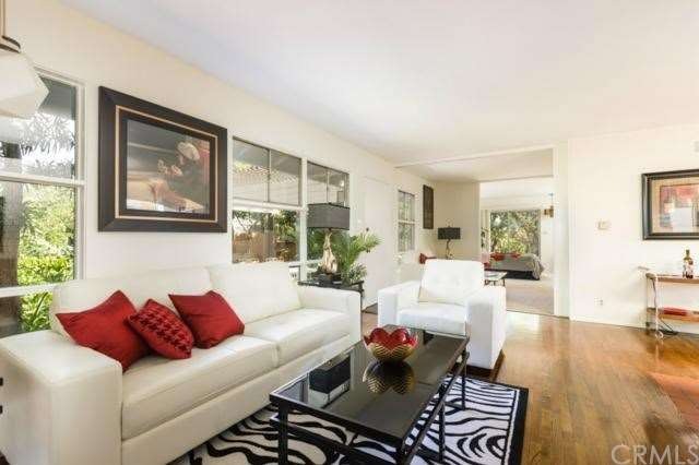 Another living room view,  den area behind.