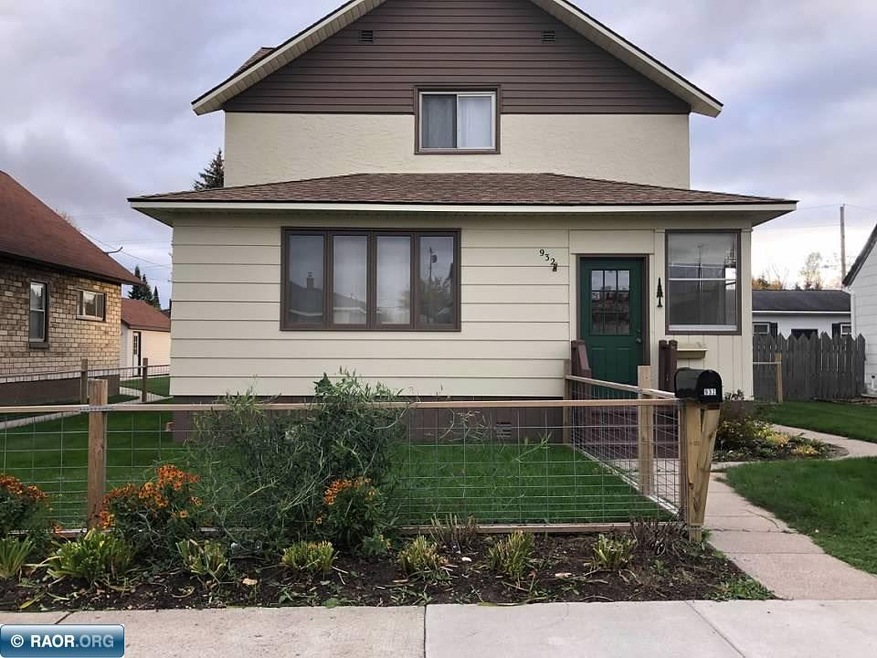 Fenced yard and flower gardens.