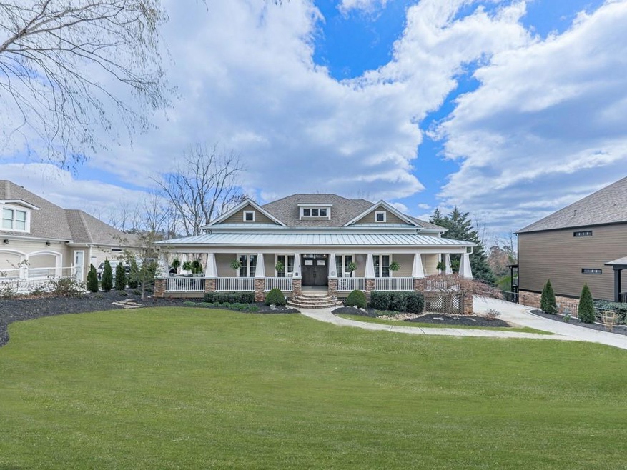View of front of home with a standing seam roof, c