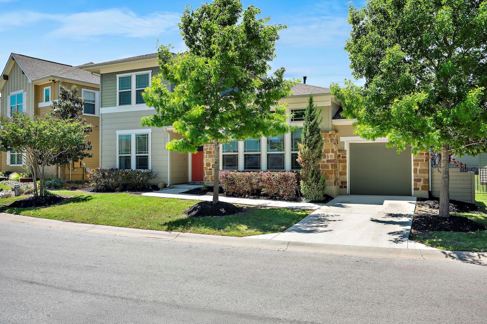 View of front of home with a front lawn, driveway