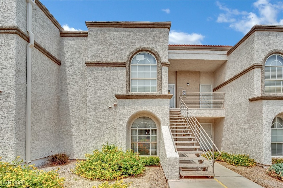 Doorway to property with stucco siding
