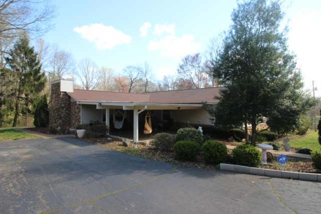 Sit outside and  enjoy this huge covered patio , one level home near the interstate and town