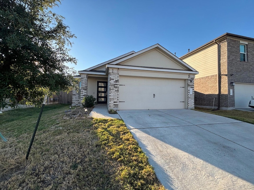 View of front facade featuring driveway, a front 