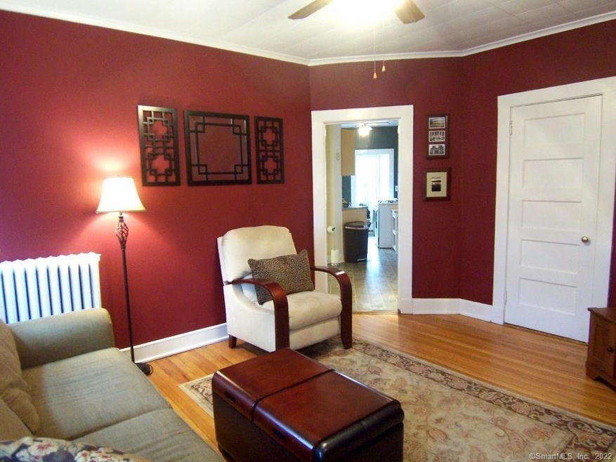 Living Room with ceiling fan and hardwood floors