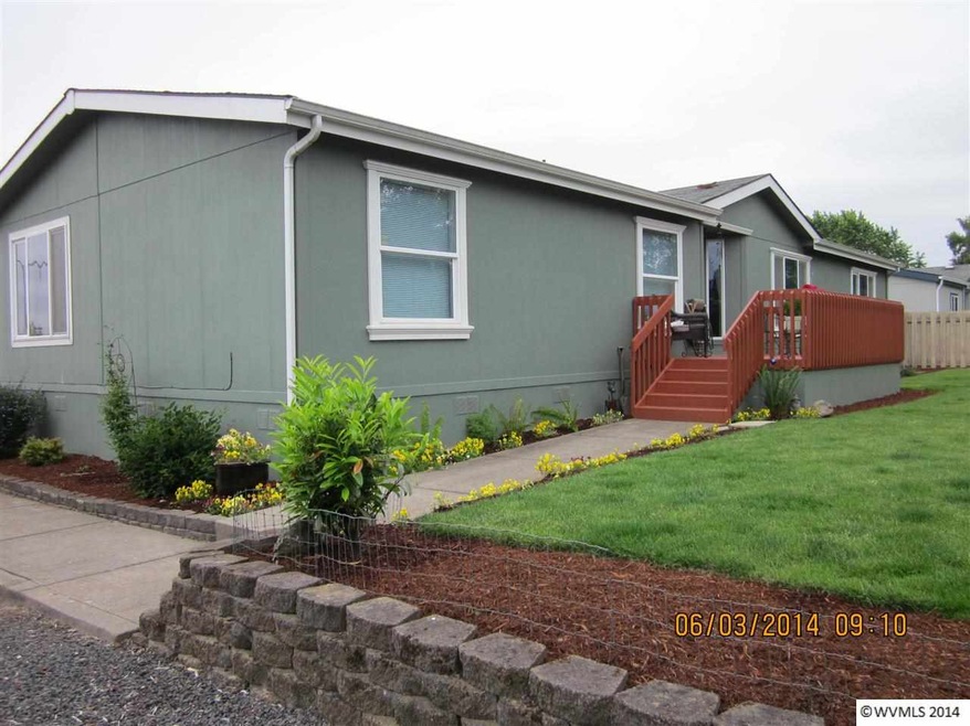 Beautifully landscaped yard with garden shed and d